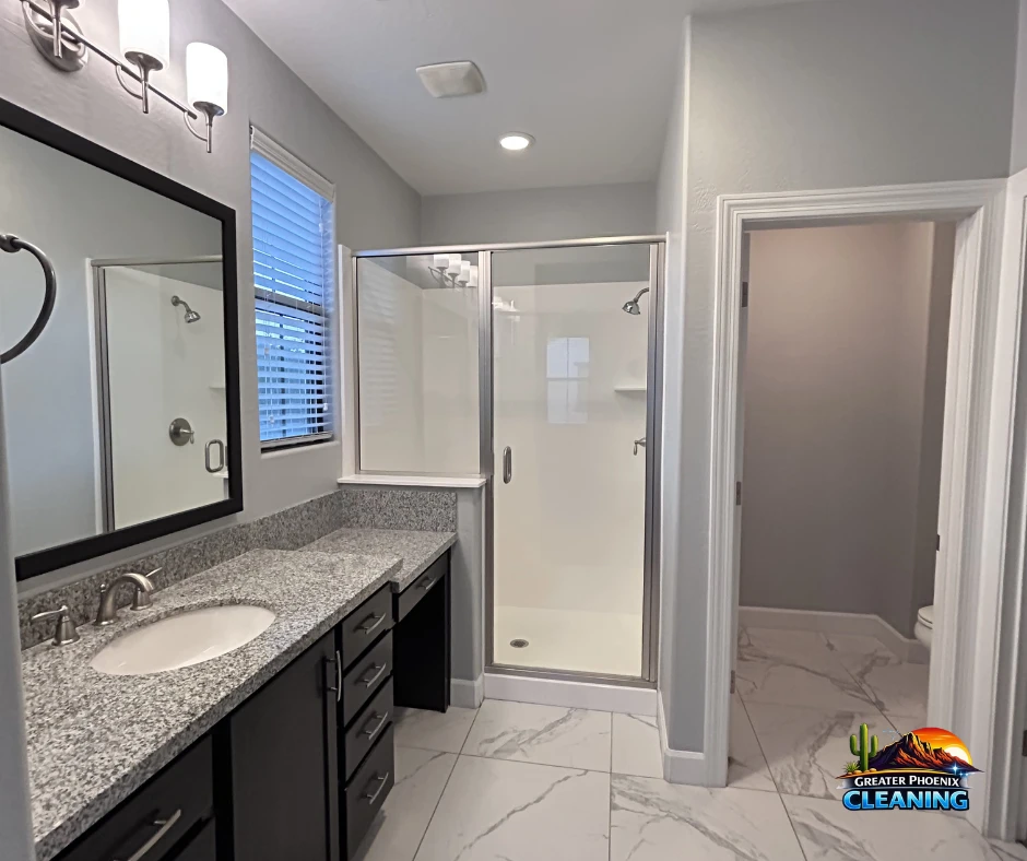Clean bathroom with clear shower glass and an uncluttered vanity