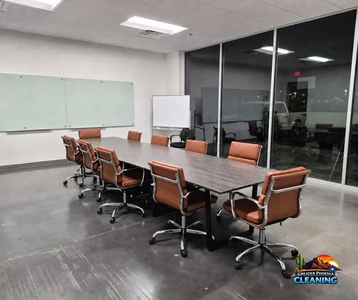 Office conference room with a long table and leather chairs, photographed on a Greater Phoenix Cleaning commercial job