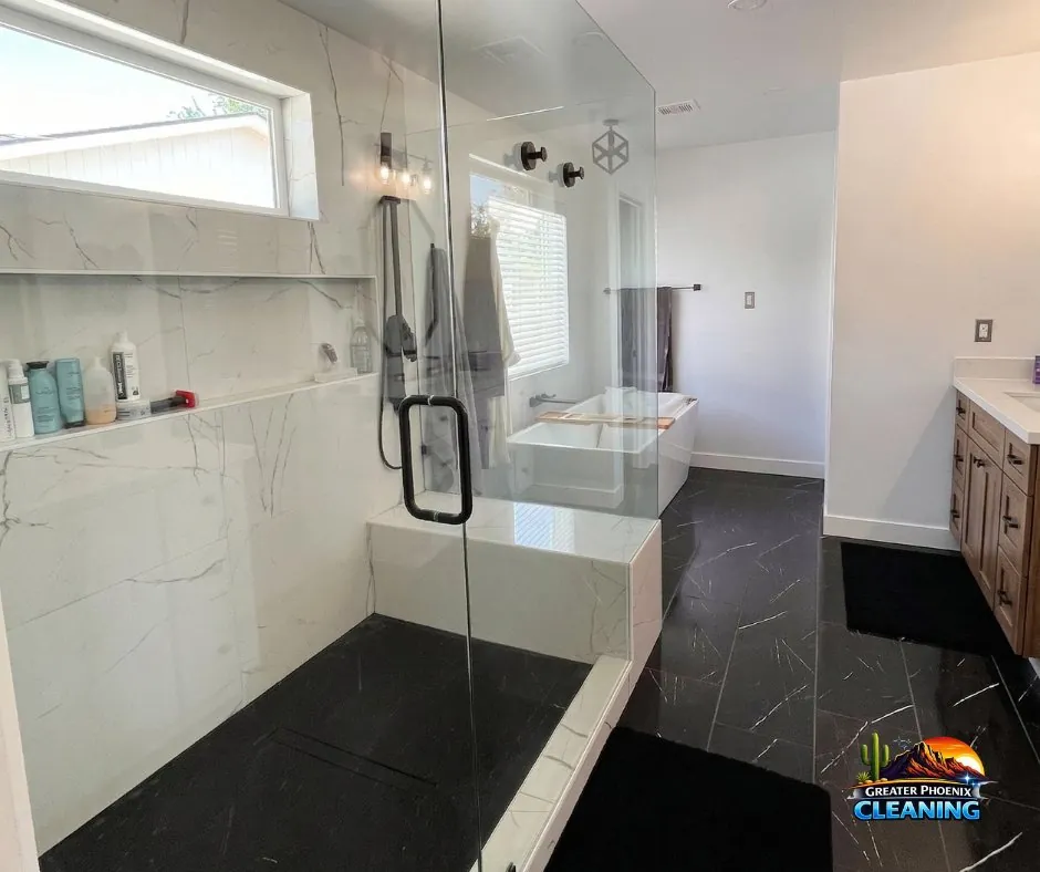 Frameless glass shower and freestanding tub after a deep clean